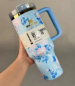 Stanley-LoveShackFancy-Travel-Tumbler-40oz-Floral-Design-blue-bg