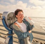 Stanley-IceFlow-Bottle-16oz-with-Flip-Straw-Leakproof,-Cold-Insulated-Stainless-Steel-Water-Bottle-Frost-girl-holding